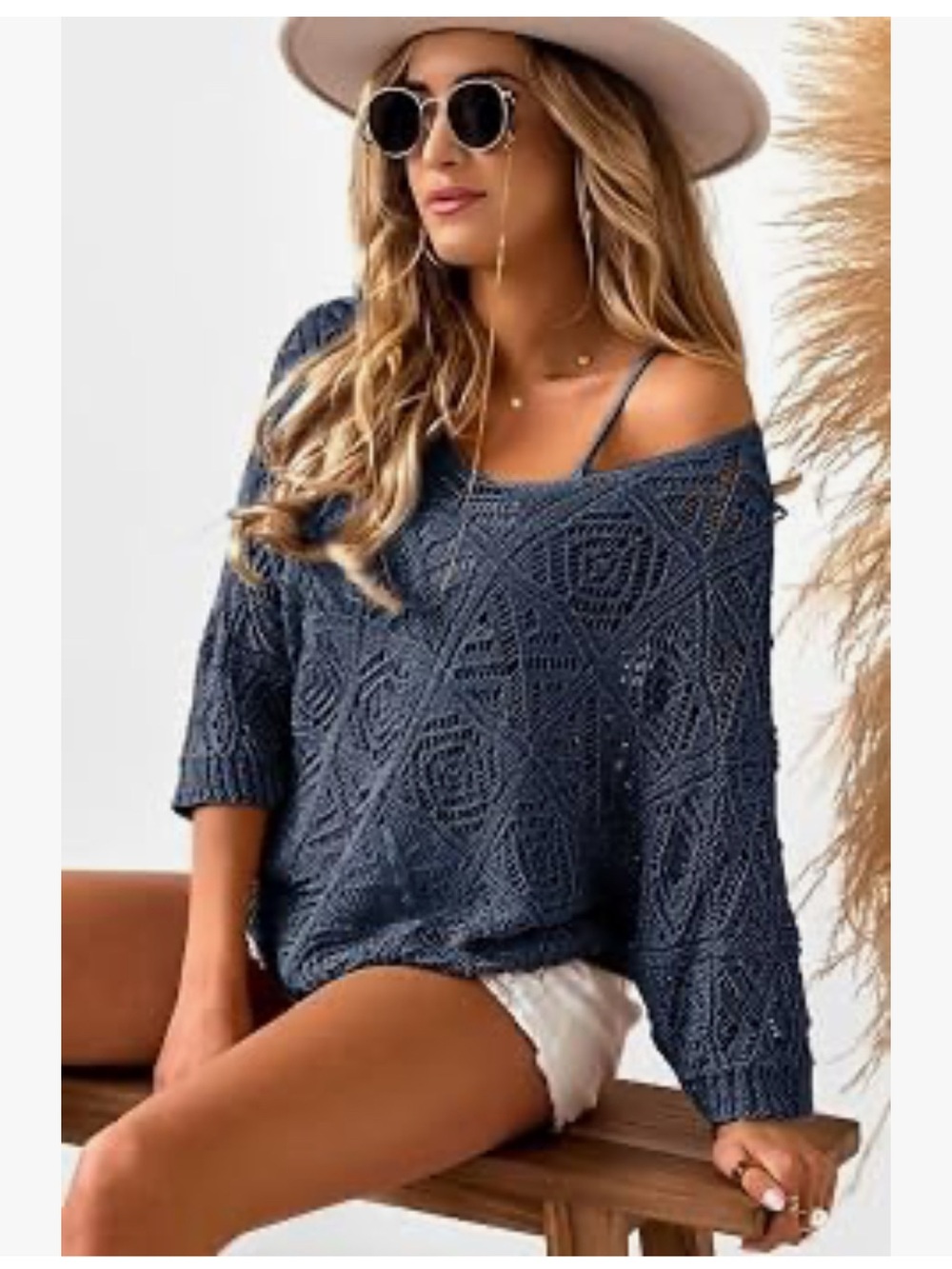 NWT Dokotoo sweater a dark navy blue color anddistinct crochet hollow-out design